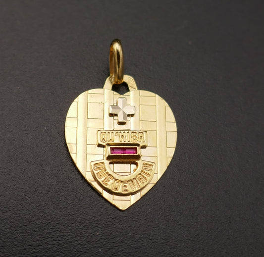 Augis, pendentif coeur, rubis calibrés, or 18 carats.