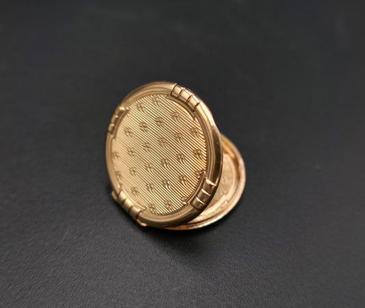 Pendentif médaillon Porte photo ou souvenir ouvrant en or jaune 18 carats.