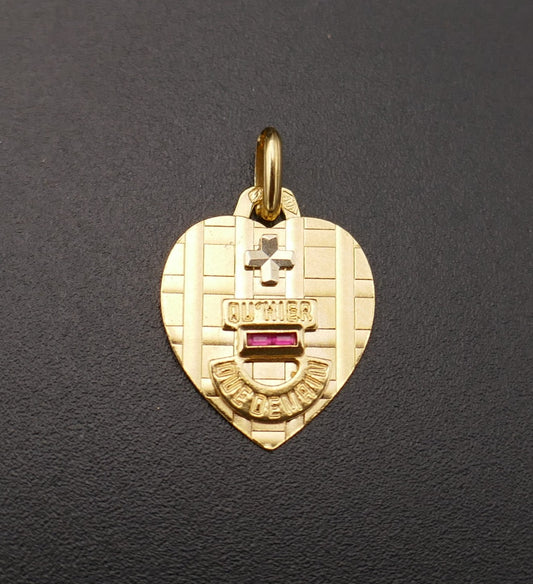 Augis, pendentif coeur, rubis calibrés, or 18 carats.